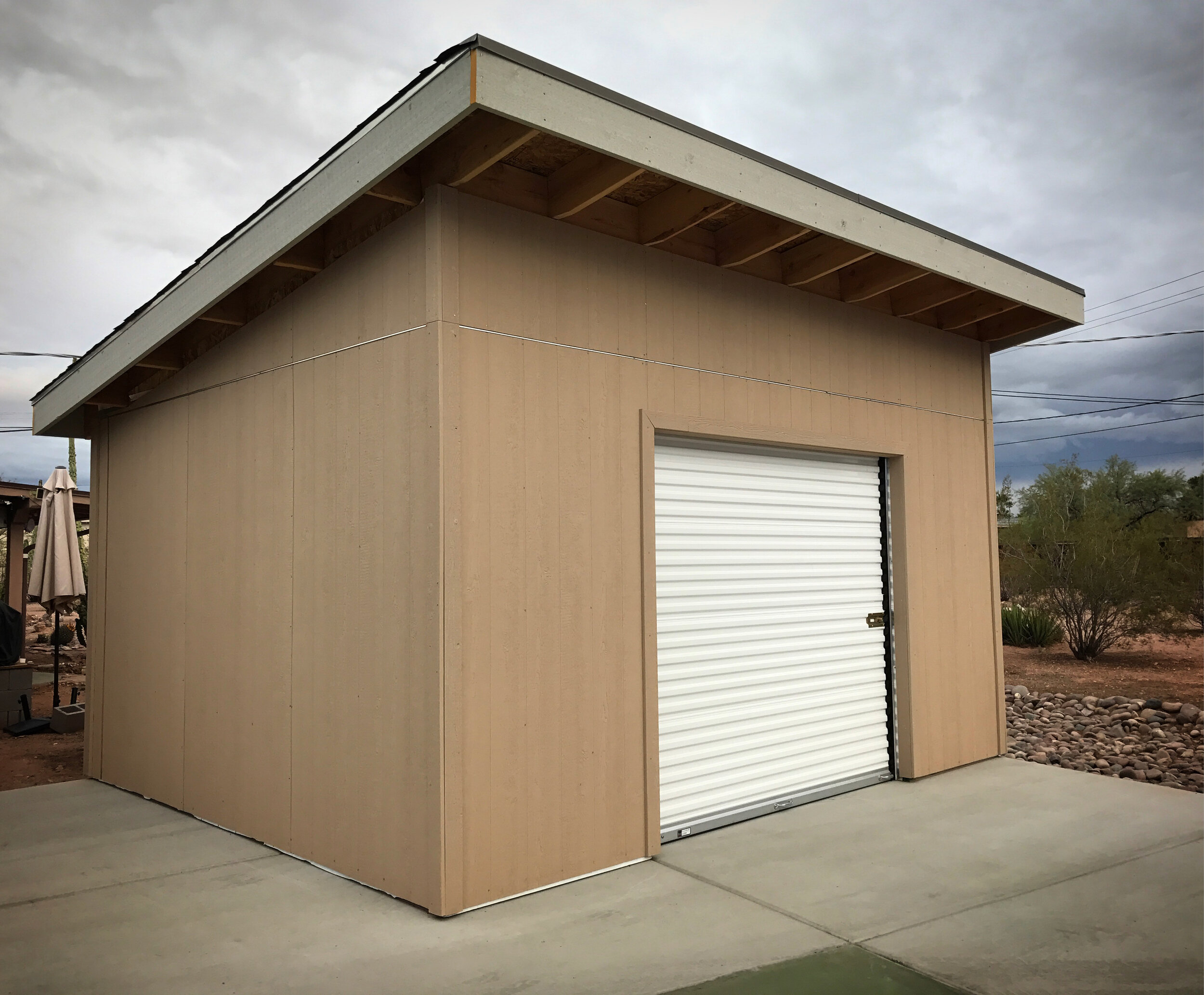 Front of the shed with the siding all up and trimmed